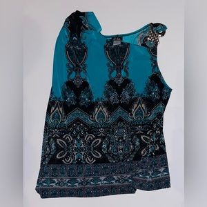 Multi color shirt with one longer sleeve